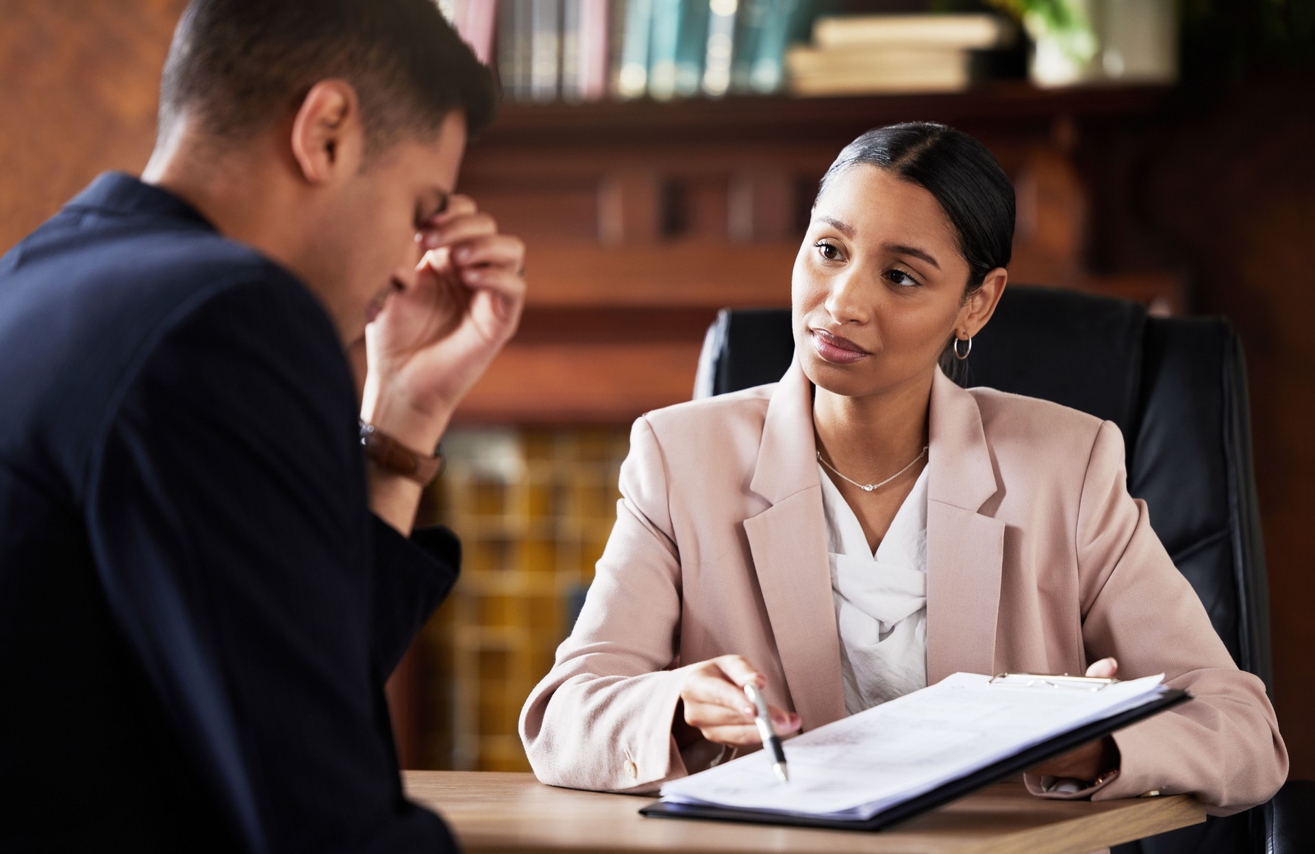 Corporate contract, lawyer explain and stress of client from legal documents and information. Business woman, will testament reading and sad man in a law firm office feeling upset about assets